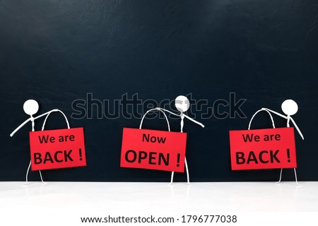 Stick man figures holding We are Back and Now Open red signage. Business and shop reopening after covid-19 pandemic concept.
