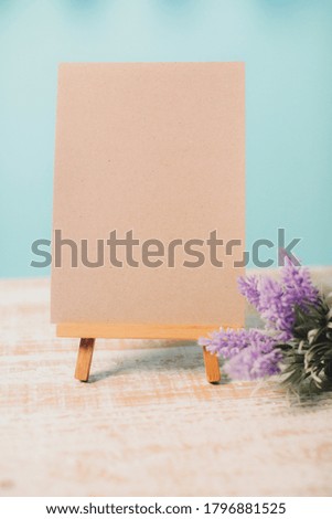 Mock up empty blank canvas on wooden easel isolated