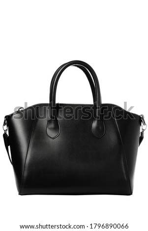 Modern designer look of a black women's handbag isolated on white background.Black business bag for women. Women's bags and accessories. Fashion bag isolated on white background. Royalty-Free Stock Photo #1796890066