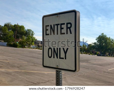 Enter only sign in the middle of a parking lot