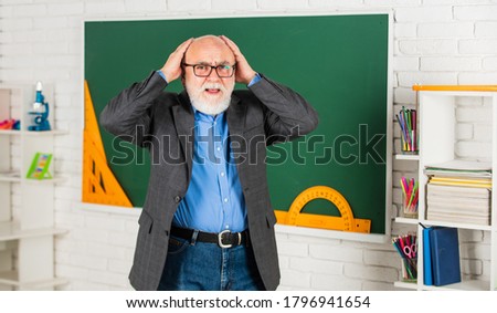hate studying maths. learn geometry easily. become good at math. stem in classroom. senior man teacher use tool at blackboard. bearded tutor in glasses. back to school. protractor ruler.