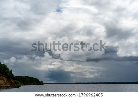Gloomy gray rain clouds in the sky. Atmospheric natural background.
