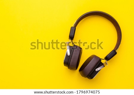 Top view black Headphone or Headset on bright color background. Copy space for text or design Royalty-Free Stock Photo #1796974075