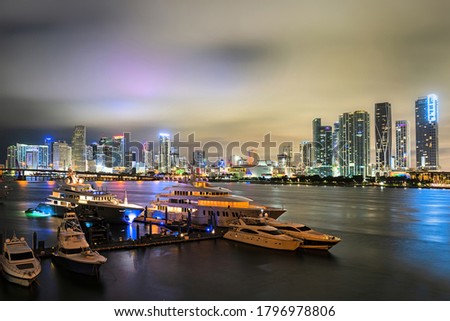 Miami downtown. Beautiful colorful city of Port Miami Florida, skyline and bay with night clouds