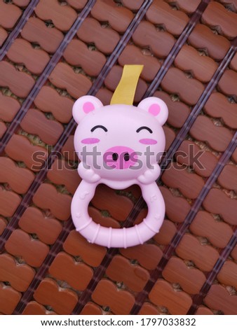a small piggy  toy  on the ground