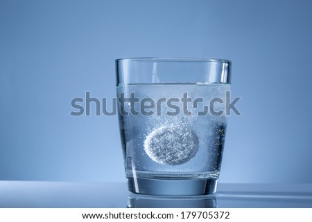 effervescent tablet in a glass of water