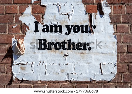 I am your Brother text on a wall