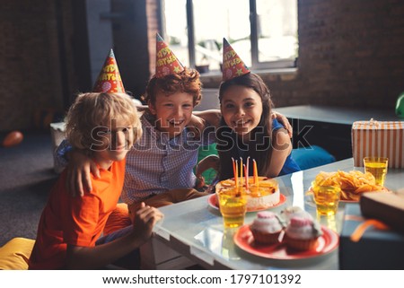 Celebration. Three kids celebrating bday and feeling wonderful