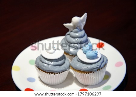 cupcakes with blue cream for baby boys