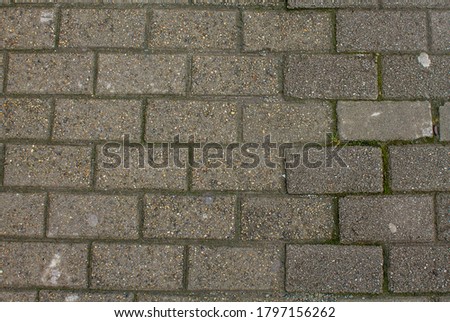 Street paving stones top view. Detailed photo of the road surface.