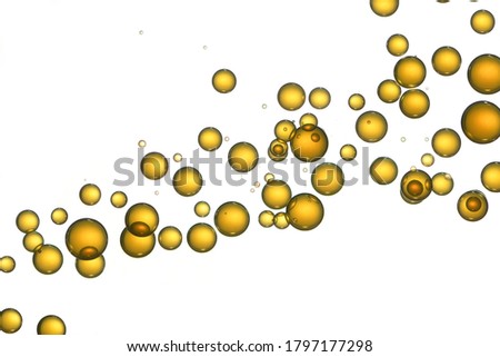 Yellow bubbles over white, isolated, shiny.