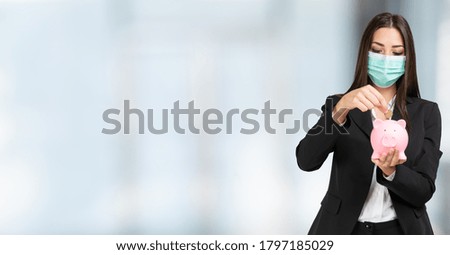 Masked businesswoman putting money in a piggy bank, banner with large copy-space