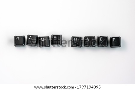 Computer keyboard keys spelling Game Over, isolated on white background