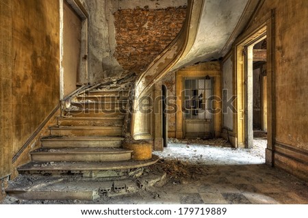 Massive stone stairway in an abandoned factory Royalty-Free Stock Photo #179719889