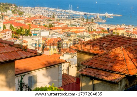 View of Sanremo City, Liguria, Italy showing old town La Pigna and new port. Picture taken from el Santuario Madonna Della Costa on a hill above the city.