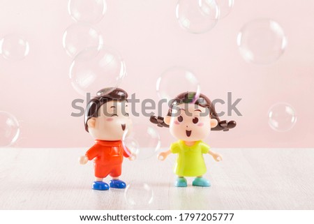 Two dolls in a bubble