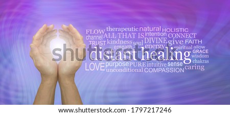High Frequency Distant healing Word Tag Cloud - cupped hands with white light beside a DISTANT HEALING word cloud against a pink blue resonating energy field 
 Royalty-Free Stock Photo #1797217246