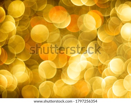 Gold bokeh holiday textured glitter background. Blurred abstract holiday background. Sparkling Glitter bokeh.