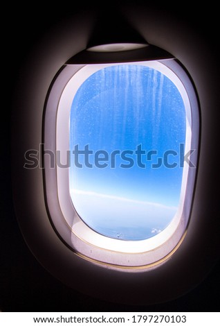 A window seat on-board a large passenger aircraft.