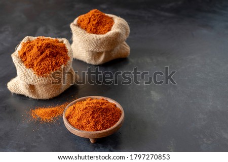 Berbere is the main part in the cuisines of Ethiopia and Eritrea. A mixture of spices, usually including red pepper, ginger, cloves, coriander, allspice. Black background. Royalty-Free Stock Photo #1797270853