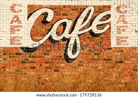 Old abandoned restaurant or cafe sign painted on a wall along Route 66 in northern Texas