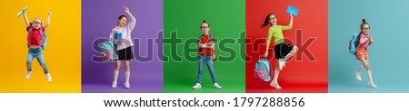 Back to school and happy time! Collage of five children on colorful paper wall background. Kids with backpack. Girls glad ready to study.