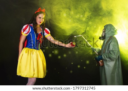 Woman holding hazardous radioactive apple. Nuclear and radiation measurement concept.