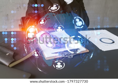 Multi exposure of woman taking notes background and people icon network hologram. Concept of social media.