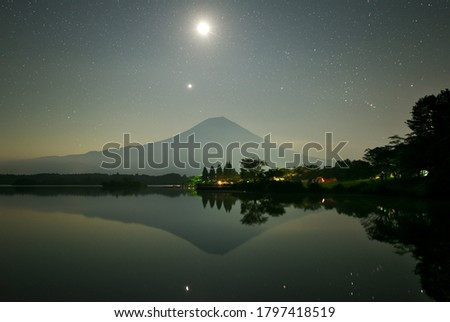 Mt.Fuji at beautiful night seen from Lake Tanuki in Shizuoka prefecture, Japan on August 15, 2020.