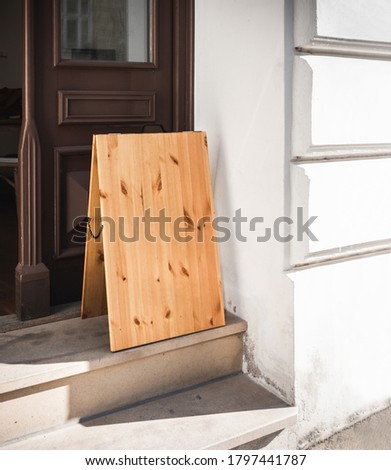 Wooden Signboard Stand Mockup Outside Store