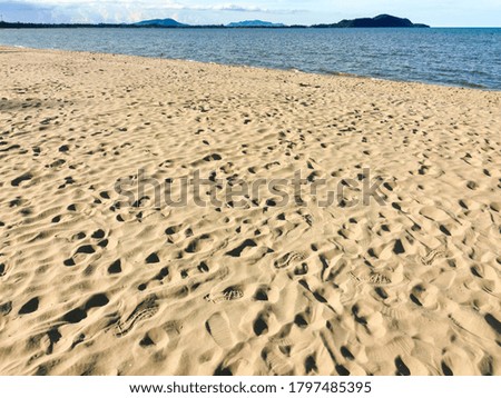 Beautiful blue ocean and sandy beach background for summer.