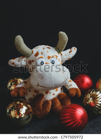 Bull toy, symbol of 2021, new year and christmas concept. Christmas background or postcard.