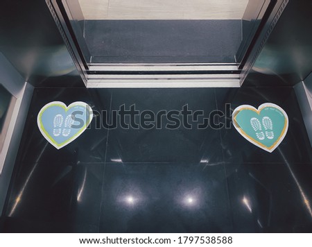 Heart-shaped placards printed on the area in the lift inform people to keep a distance of 6 feet apart to prevent the spread of the coronavirus, or COVID-19.