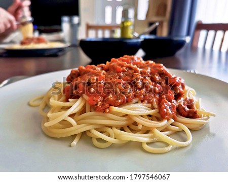 Spaghetti Bolognese with minced beef, onion, chopped tomato, garlic, olive oil, stock cube, tomato puree and Italian herb. Traditional Italian food.  Happy meal with with family.  Home sweet home. 