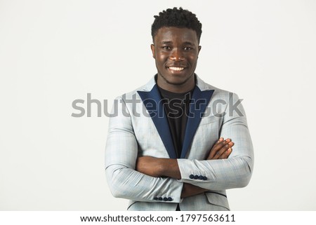 handsome young african male in jacket, on white background