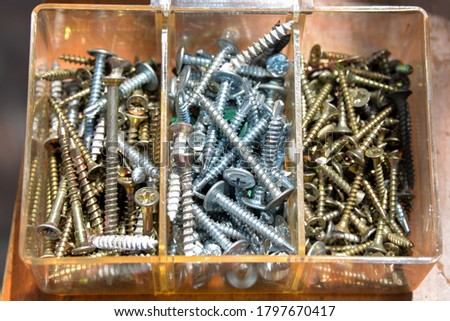 a lot of metal screws in the box, with their help, repairs are made.