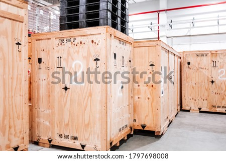 Wooden boxes in the warehouse. Boxes out of wood for packing industrial machinery. Warehousing. Packaging of finished products of the plant. Sale of packaging materials. Royalty-Free Stock Photo #1797698008