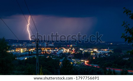 Lightning strike in the rain at night over City Zalaegerszeg, Hungary