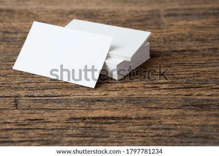 Stack of Business card on wood background and copy space