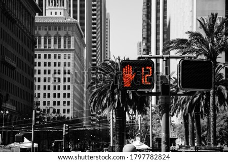 Traffic Signal Do Not Walk Illuminated Sign in a Busy City Street. Red Hand Color Isolated Stoplight at a Pedestrian Crosswalk Intersection 