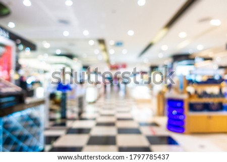 Abstract blur luxury shopping mall and retails in department store interior for background