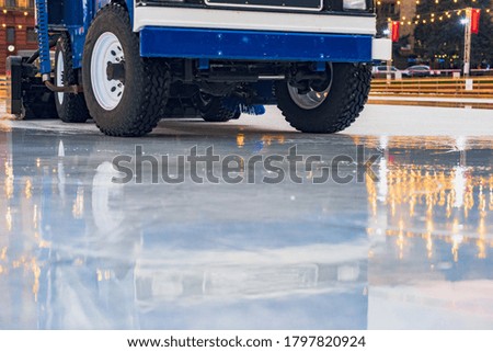 Closeup photo of resurfacer cleaning and polishing ice rink