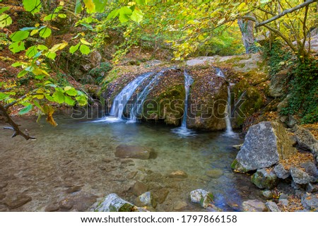 Photos of the Crimean peninsula in autumn Jur-Jur Waterfall is a landmark in the vicinity of Alushta, the Ulu-Uzen River at an altitude of 468 meters above sea level. Translated its name as "babbling"