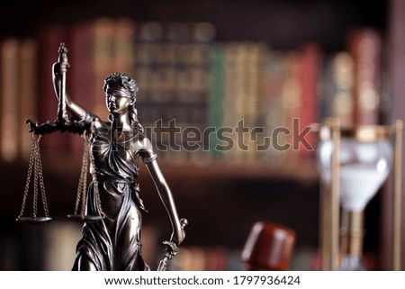 Law code concept. Justice symbols on library background.