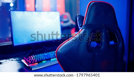 Professional gamers cafe room with powerful personal computer game chair blue color. Concept cyber sport arena.
