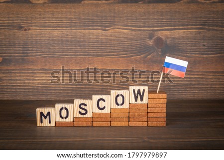 MOSCOW. City in RUSSIA. Steps and flag on a wooden background