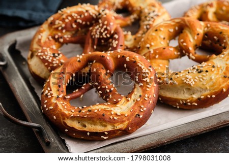 Homemade whole meal pretzels with sesame and salt. Oktoberfest. Royalty-Free Stock Photo #1798031008