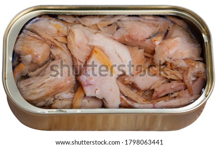 Picture of  tasty  canned tuna in open tin can with greens and lemon. Isolated over white background