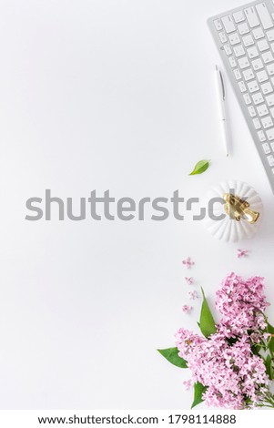 Flat lay office table desk with jasmine flowers bouquet. Workspace with laptop