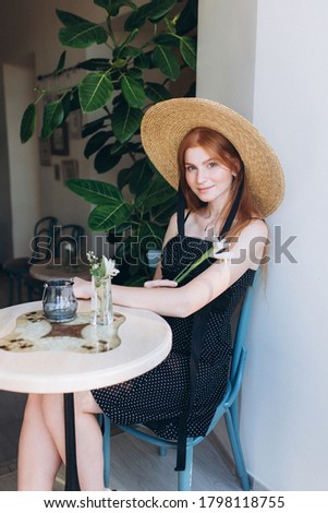 Young woman face with freckles, happy pretty caucasian ginger girl in cafe